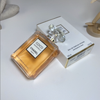 Chanel Coco Mademoiselle perfume bottle and packaging on a white surface